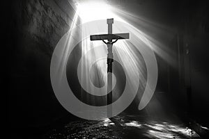 A crucifix illuminated by rays of light in a dark room, signifying divine presence photo