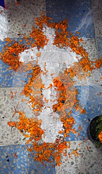 crucifix made of limestone powder and petals
