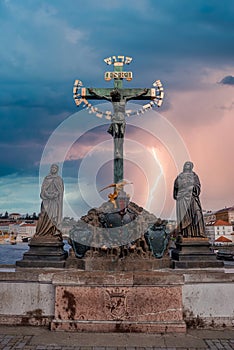 Crucifix on pedestrians only Charles Bridge over Vltava river in Prague, Czech Republic