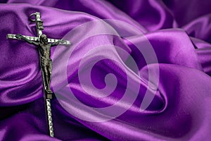 Crucifix on purple background