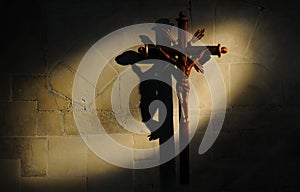 Crucifix on stone wall photo