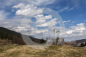 A crucifix on a wood cross in Apuseni Mountain, Transylvania, Romania