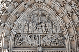 Crucifixion of Christ scene at major entrance portal of Saint Vitus Cathedral in Prague, Czech Republic, details, closeup