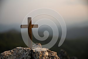 Crucifixion Of Jesus Christ - Cross At Sunset. Silhouette cross on Calvary mountain sunset background. Easter concept