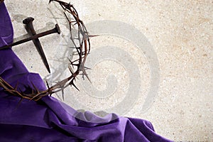 Crucifixion Of Jesus Christ. Cross With three Nails And Crown Of Thorns on ground