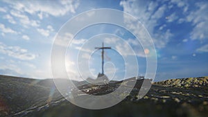 Crucifixion of Jesus Christ with thorn crown, nails, hammer and a rope against blue sky and flying pigeons, 4K