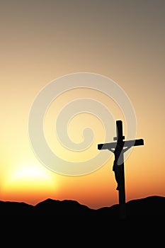 Crucifixion and sunset vertical