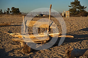 Crude bench made out of washed up logs and driftwood