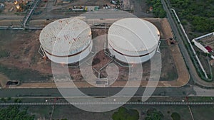 Crude oil depot facility at petrochemical factory. Drone flying energy plant