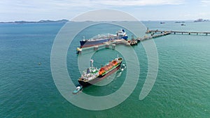 crude oil floating station in sea, bridge pipeline load unloading crude oil from oil ship transport, industry business