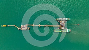 crude oil floating station in sea, bridge pipeline load unloading crude oil from oil ship transport, industry business