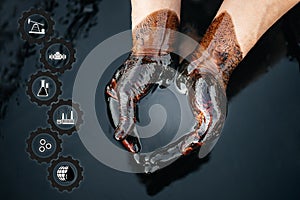 Crude oil in the hands due to a fuel oil leak. process of processing petroleum products. Cupped hands with fuel oil. the