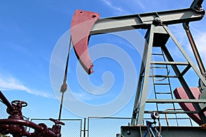 Crude oil jack pump under blue sky in europe