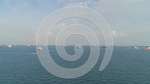 Crude Oil tanker and LPG Loading in port at sea view from above. Shot. Landscape from bird view of Cargo ships entering