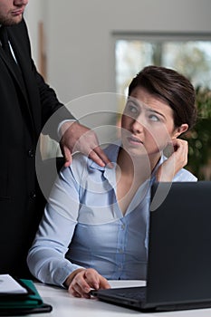 Cruel boss controlling his employee photo