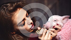 Cruelty free. No animal cosmetics testing. Animal rights protest. Woman with lipstick and pig.