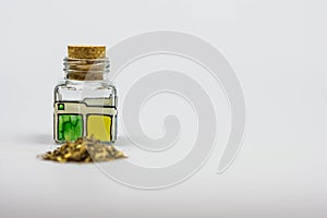 Cruet with herbs on a white background
