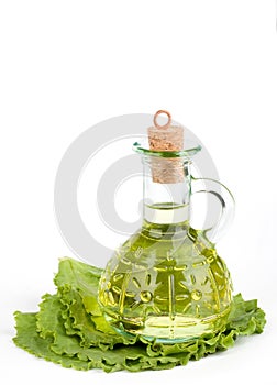 Cruet with oil on lettuce photo