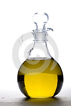 A cruet of olive oil.