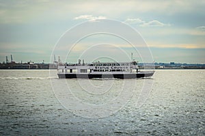 A Cruise Boat full of Tourists  on its Way to Statue of Liberty Island in New York City