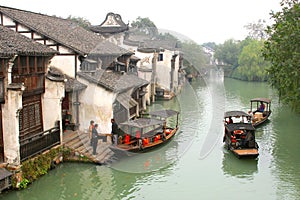 Tourist canal boats in the ancient water town Wuzhen (Unesco), China