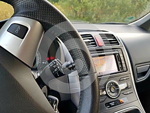 Cruise control switch of Japanese car with big navigation display photo