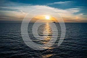 Cruise ferry silhouette against sunset