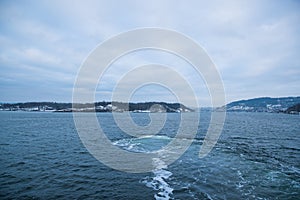 The cruise between the Islands Islands around Oslo Norway during the winter overlooking the sea and the Fjord