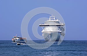 Cruise liner and motoboat in port