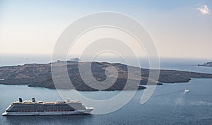 Cruise liner at the sea near the Greek Islands. Beautiful landscape with sea view. Santorini island, Greece
