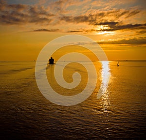 Cruise liner in the sea at sunset