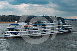 Cruise liner with tourists on the river Volga