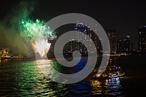 Cruise on the river at night with fireworks. Bangkok, Thailand.