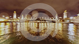 Cruise on the River Seine illuminated city at night in Paris, Time lapse