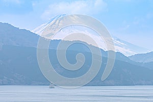 A cruise sailing in Ashinoko lake with snow cap Fuji mountain (Fujisan) , Hagone