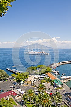 Cruise Sailship on anchor at the Sorrento Wharf with mount Vesuvius on the backround