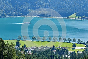 Cruise ship on Achen lake Achensee, Austria, on a sunny Summer day - view from an elevated vantage point
