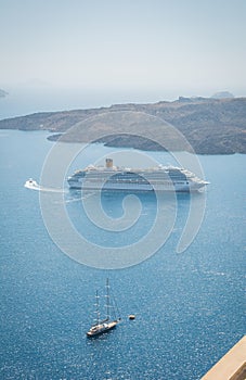 cruise ship anchored off a volcanic island Nea Kameni