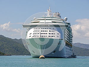 Cruise Ship Anchored With Small Boat