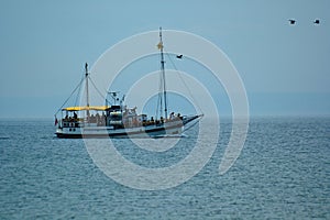 Cruise ship on a background of blue sea and cloudless sky