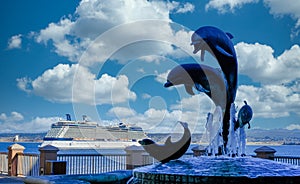 Cruise Ship Beyond Dolphin Sculpture