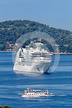 Cruise ship and boat portrait format in the Mediterranean Sea Aegean island of Skiathos, Greece