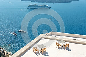 Cruise ship and boats close to the Santorini island. Greece