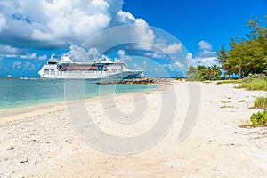 Cruise ship on Caribbean Sea close to paradise beach. Tropical travel concept and destination for vacation. Recreation and