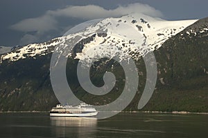 Cruise ship crusing Fjord in Alaska Inside Passage