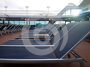 Cruise ship deck chairs ready for passengers to relax.