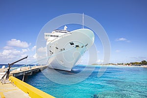 Cruise Ship Docked At Port, On Tropical Beach