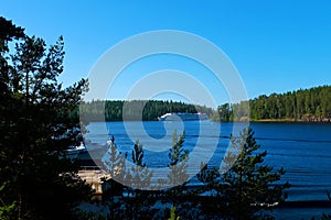 A cruise ship enters the bay of Lake Ladoga on a sunny summer day. Travel and tourism concept