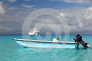 Cruise ship and fishing boat in blue ocean