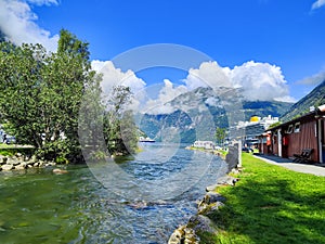 Cruise ship in the fjord in Norway, Mountain landscape with a river